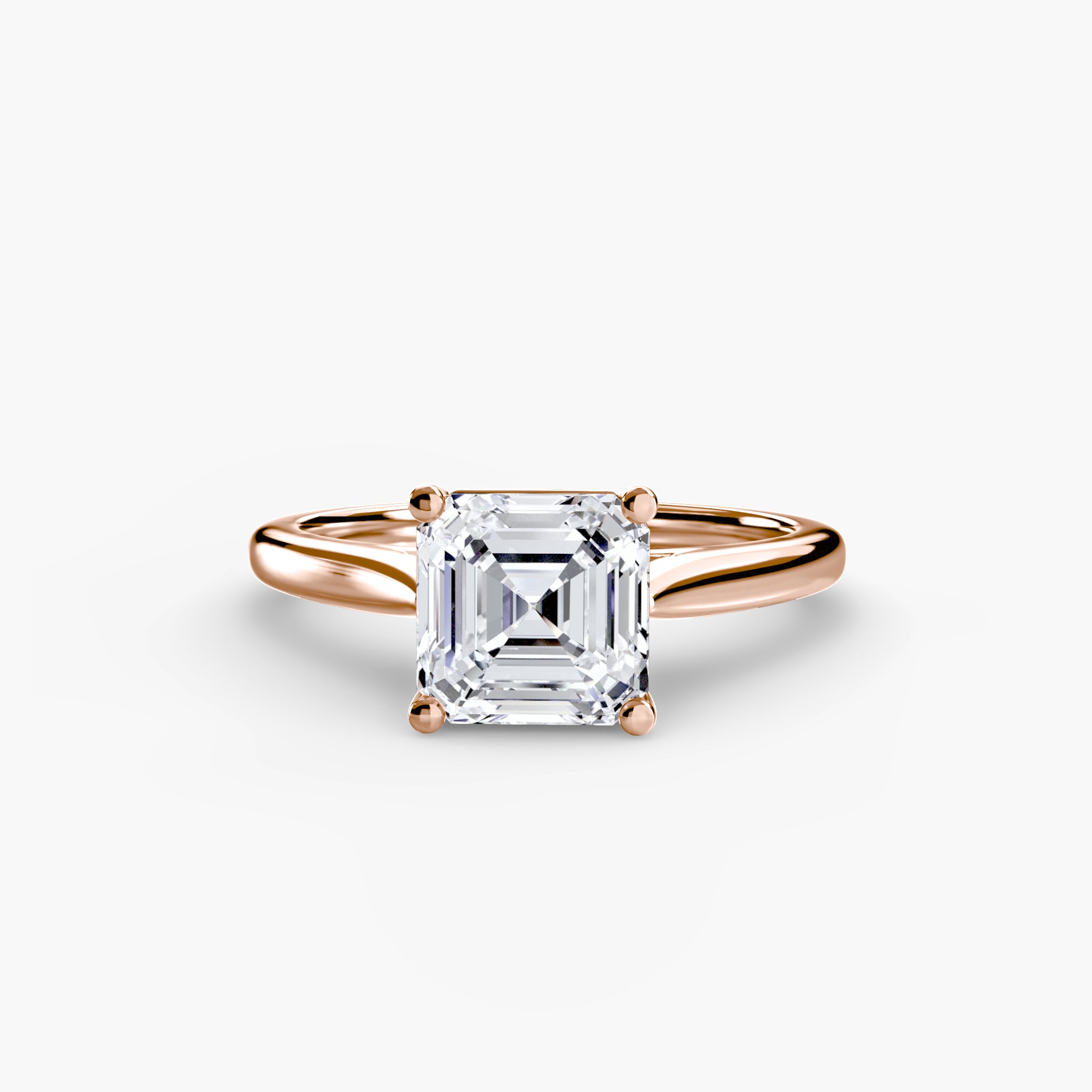 Rose gold ring with a large diamond on a white background