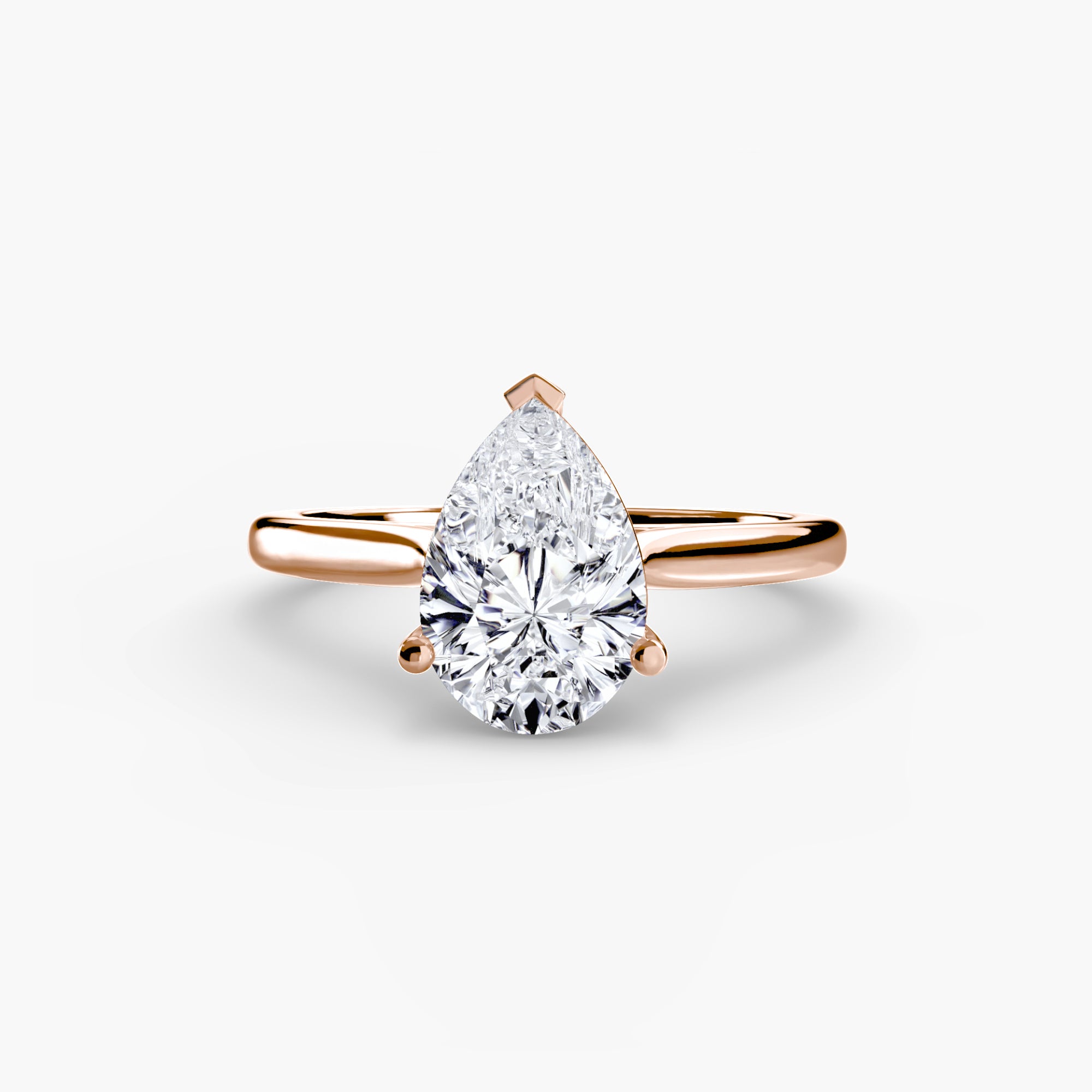 Rose gold ring with a pear-shaped diamond