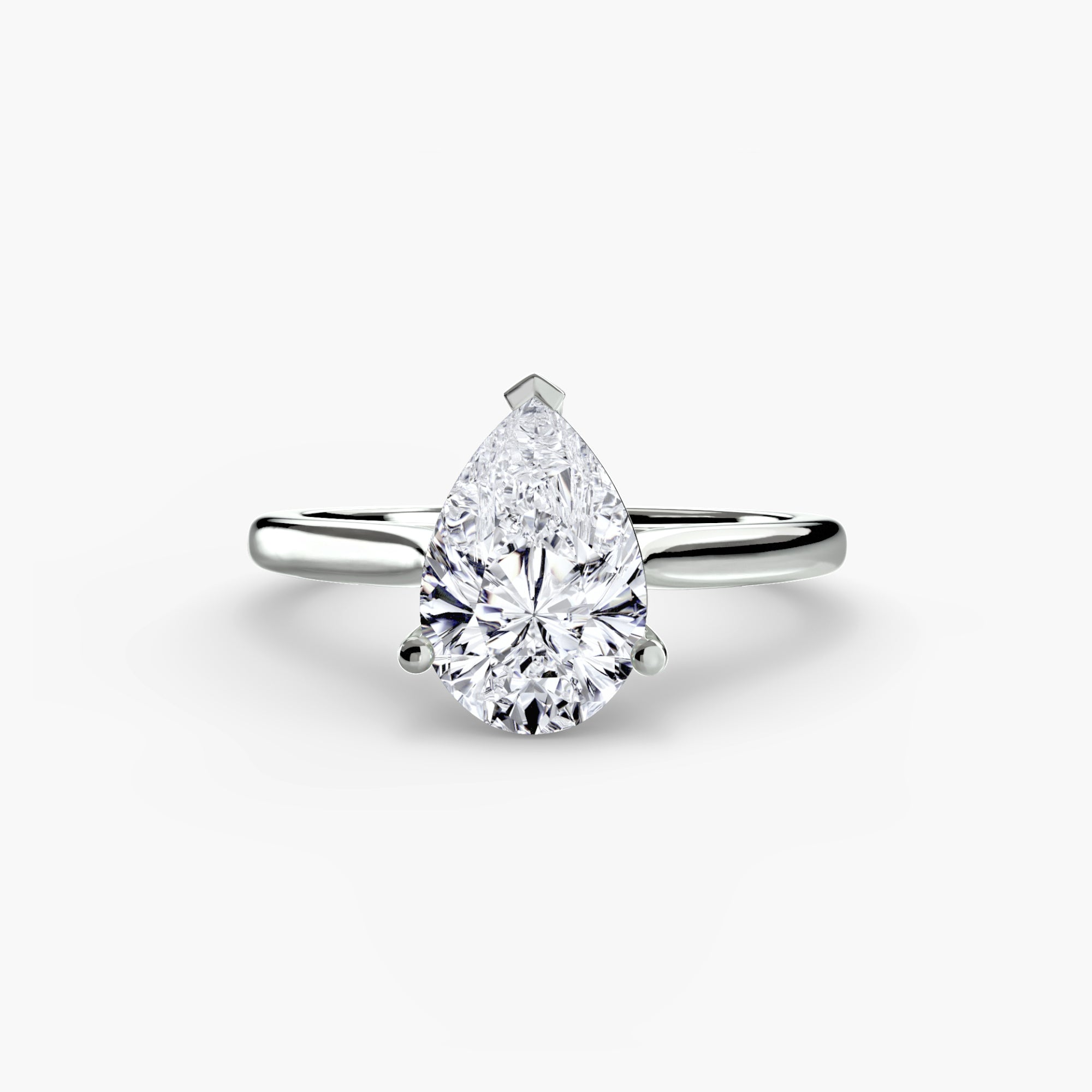 Pear-shaped diamond ring on a white background