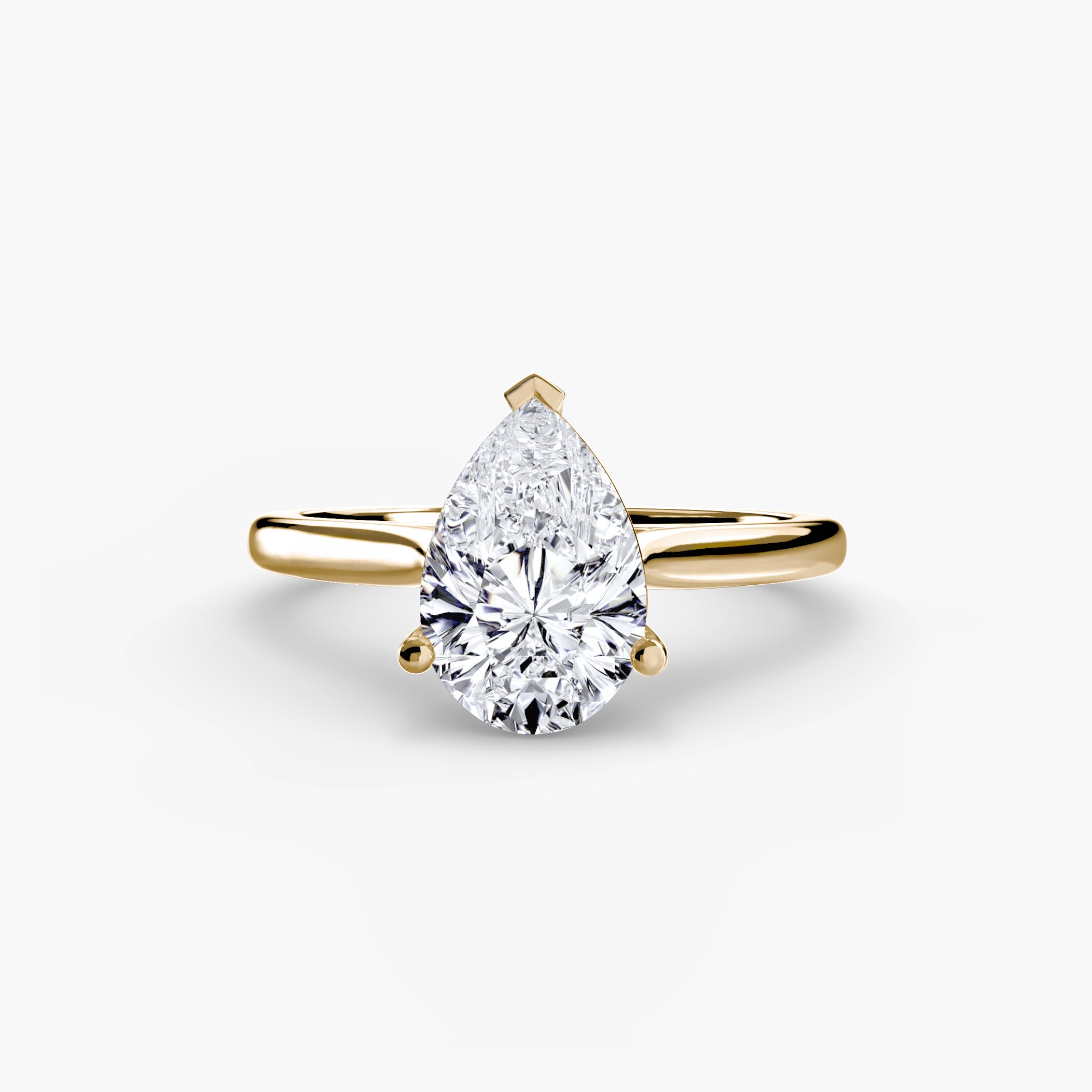 Gold ring with a pear-shaped diamond