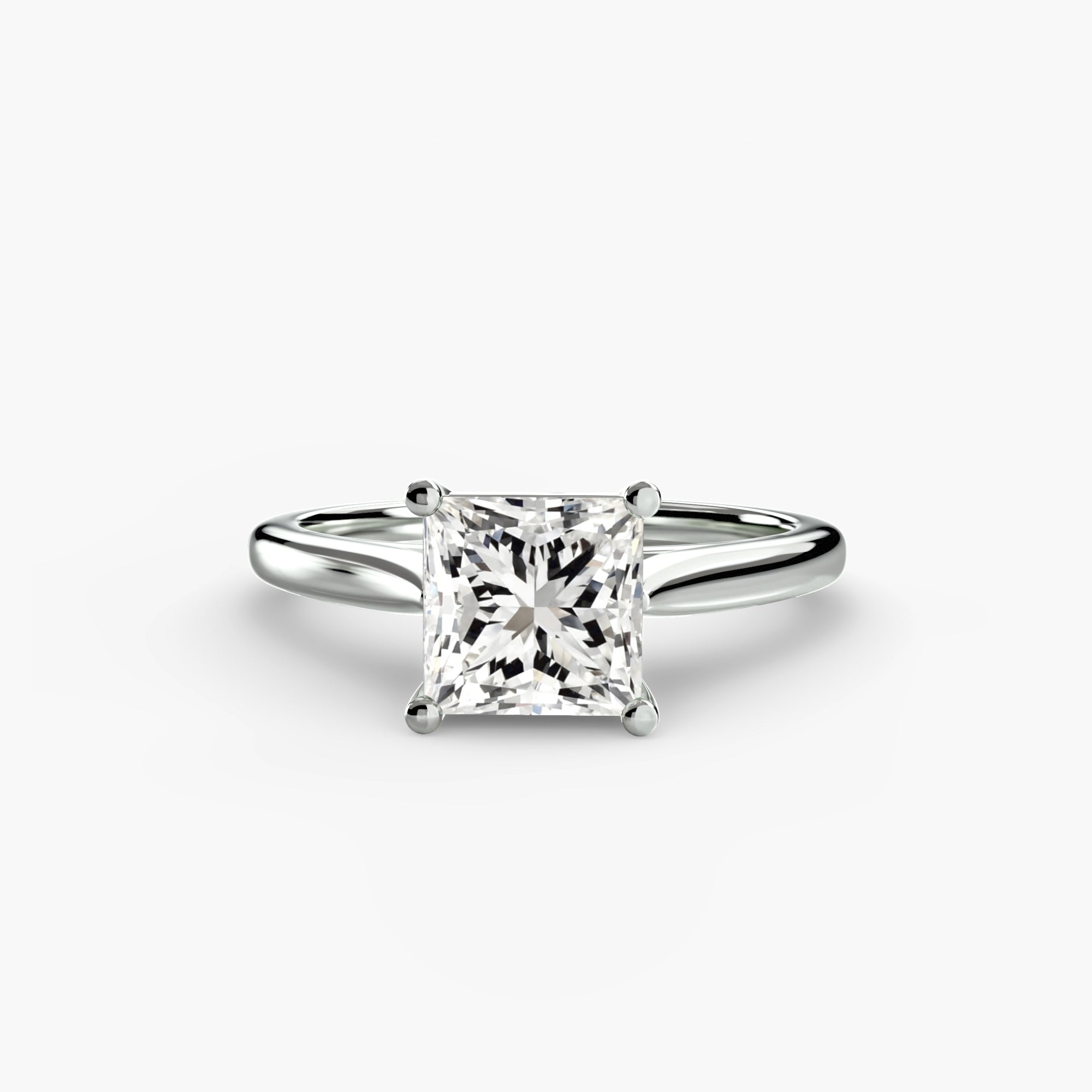 Diamond ring with a square-cut gemstone on a white background