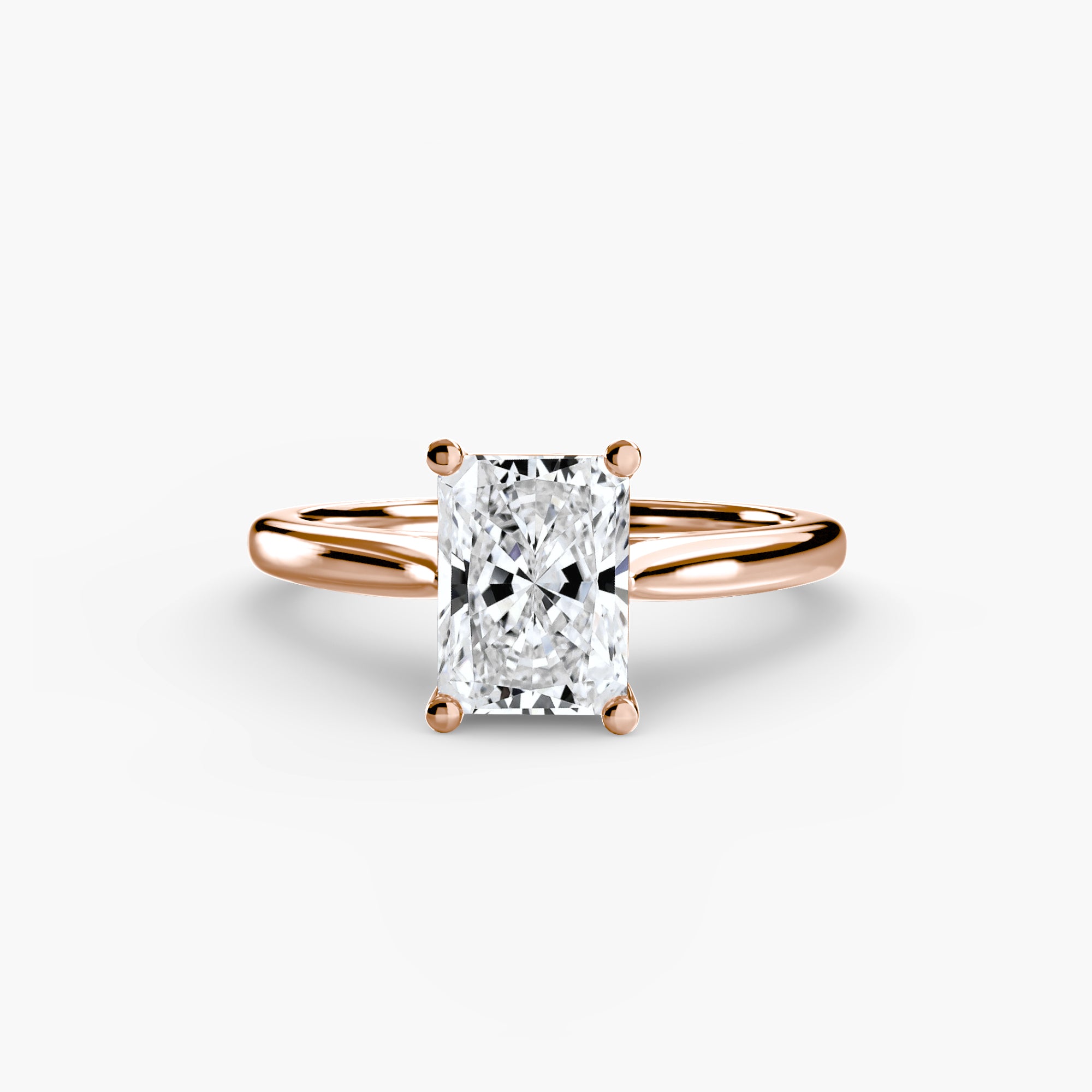 Rose gold ring with a diamond on a white background