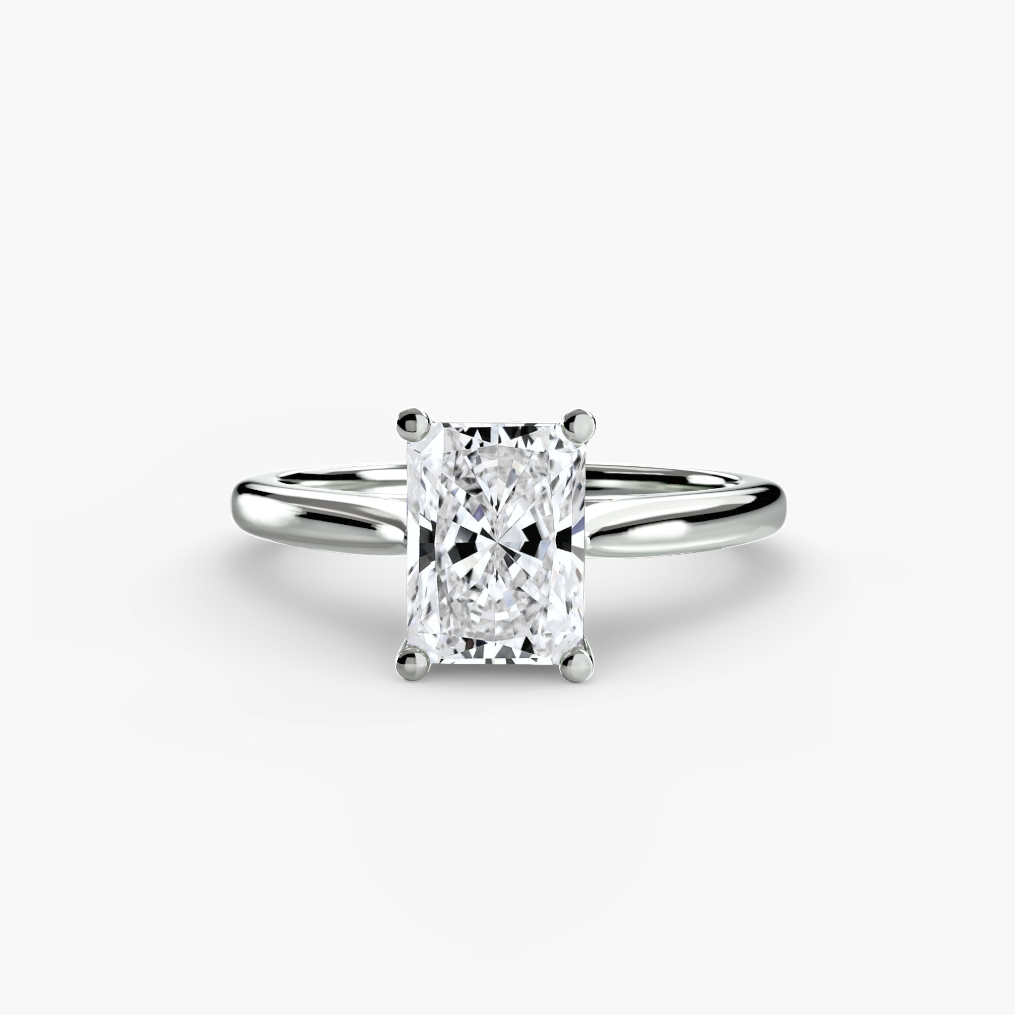 Diamond ring with a rectangular cut gemstone on a white background