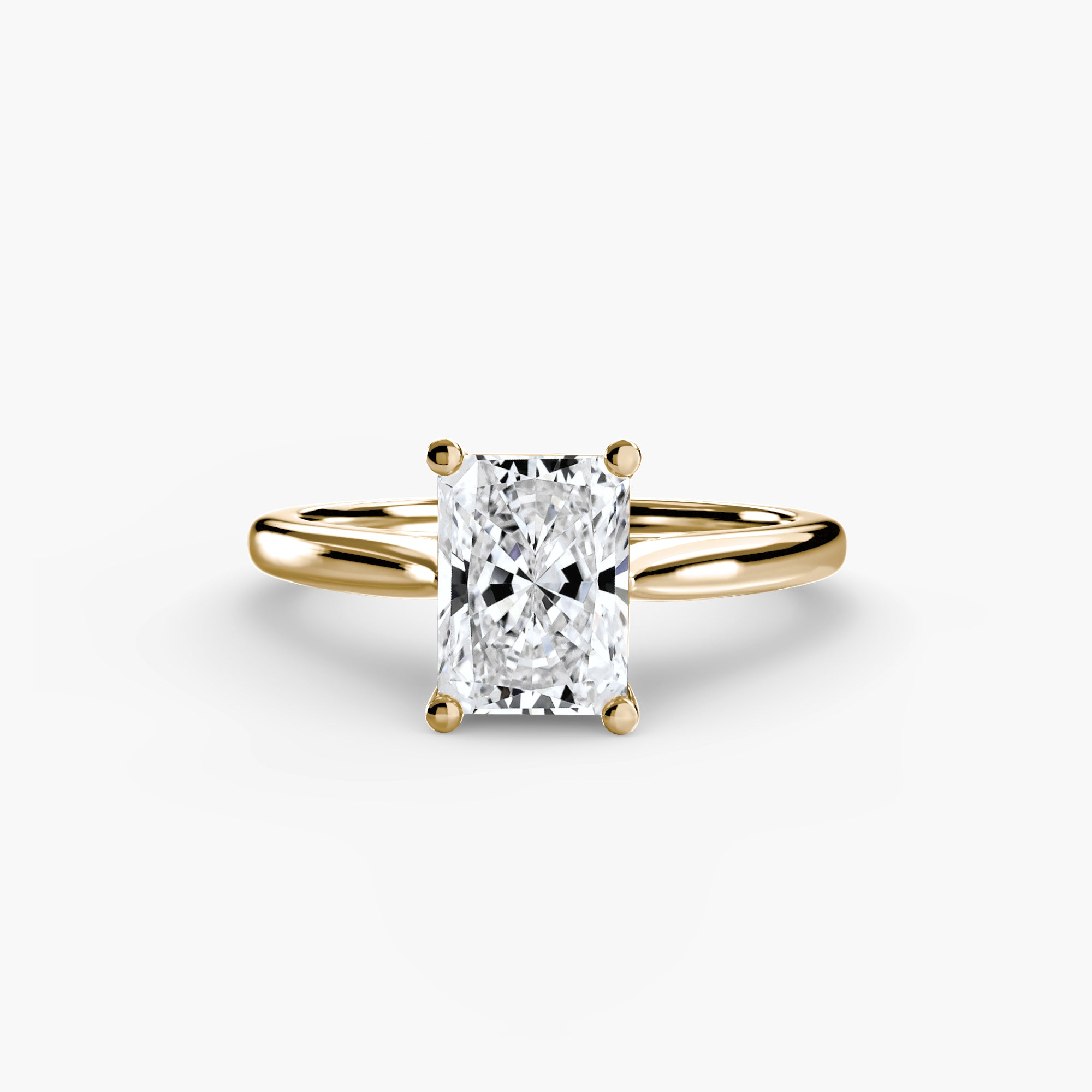 Gold ring with a diamond on a white background