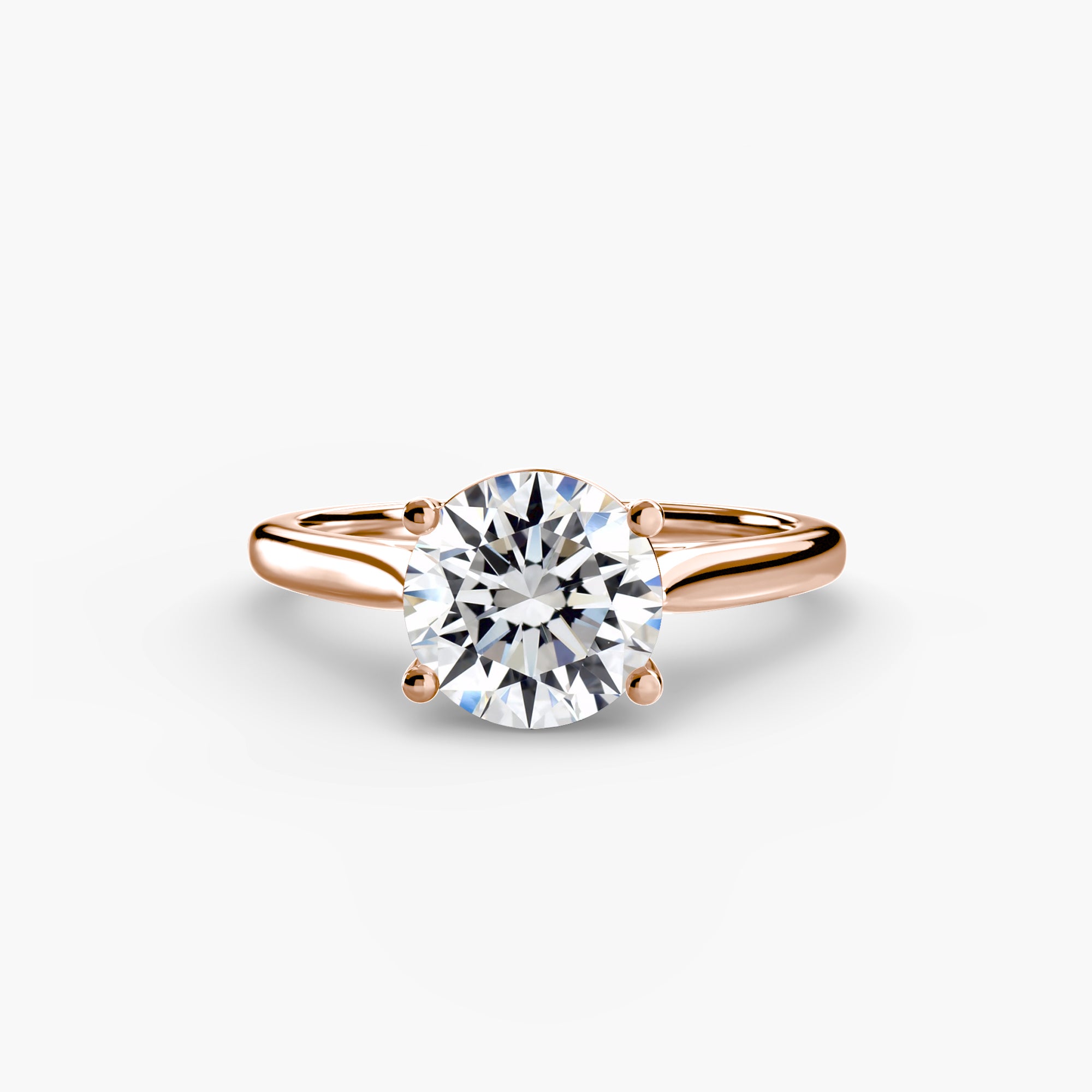 Gold ring with a diamond on a white background