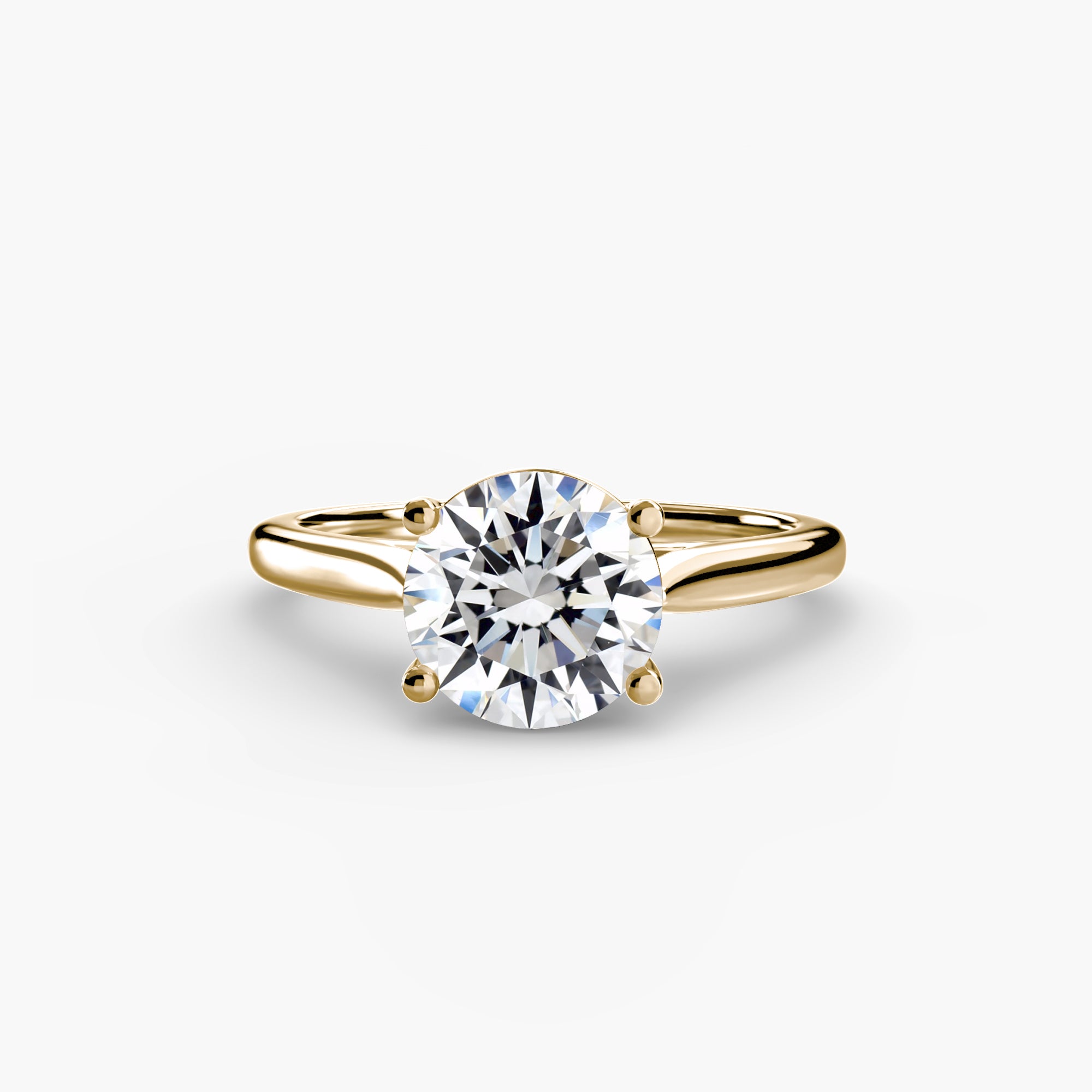 Gold ring with a diamond on a white background