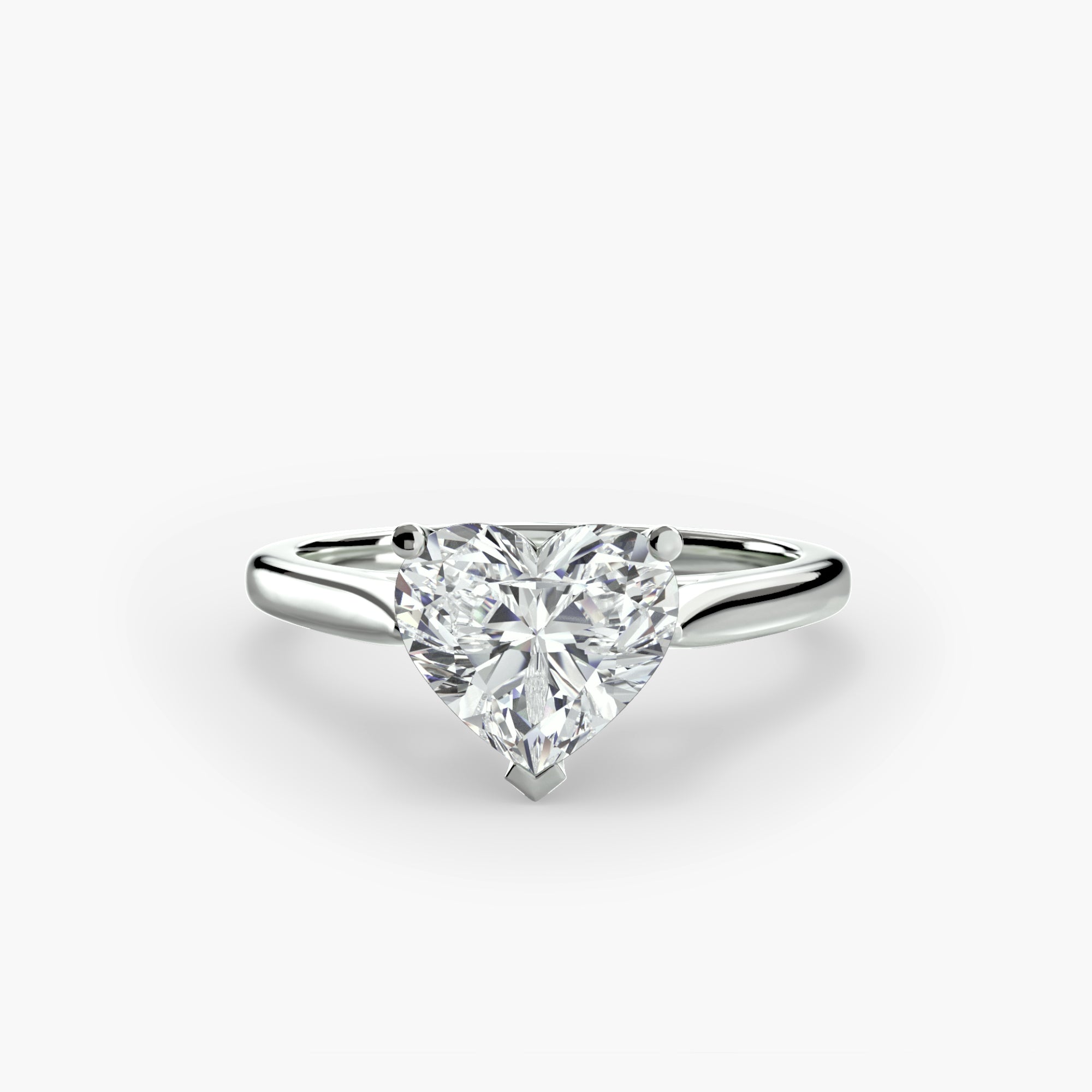 Diamond ring with a heart-shaped gemstone on a white background